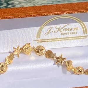 14K Yellow Gold Starfish, Sea Shell, Sand Dollar and Fish Bracelet